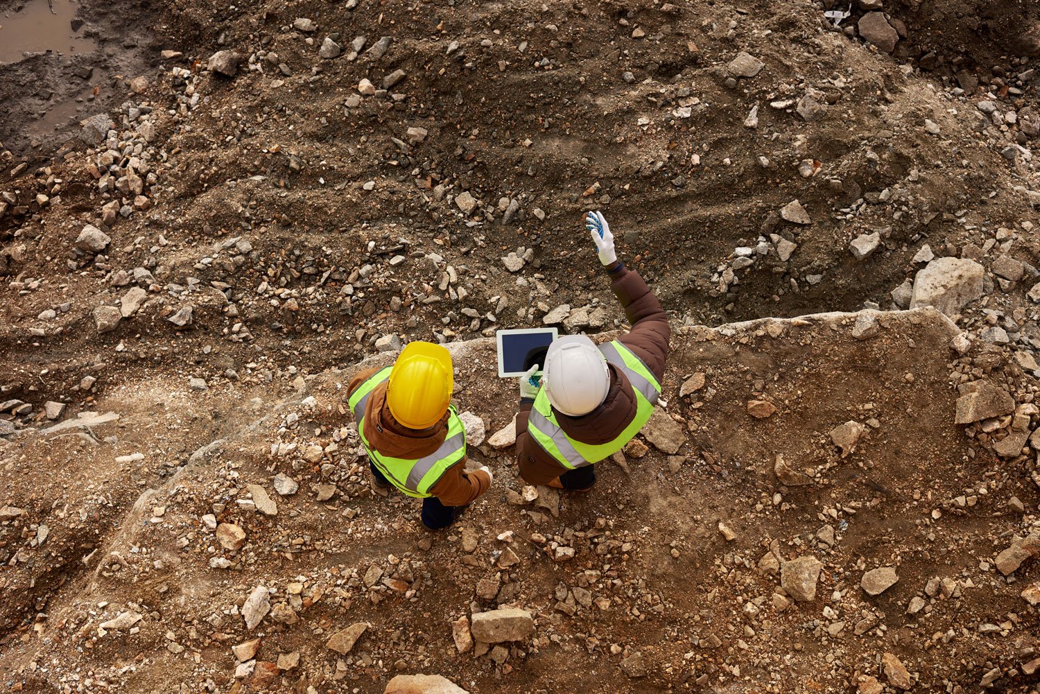two-construction-workers-inspecting-site